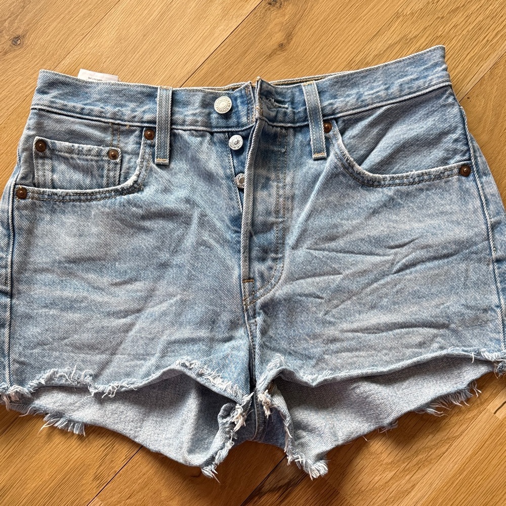 Levi’s 501 High Rise Raw Hem Light Wash Jean Shorts